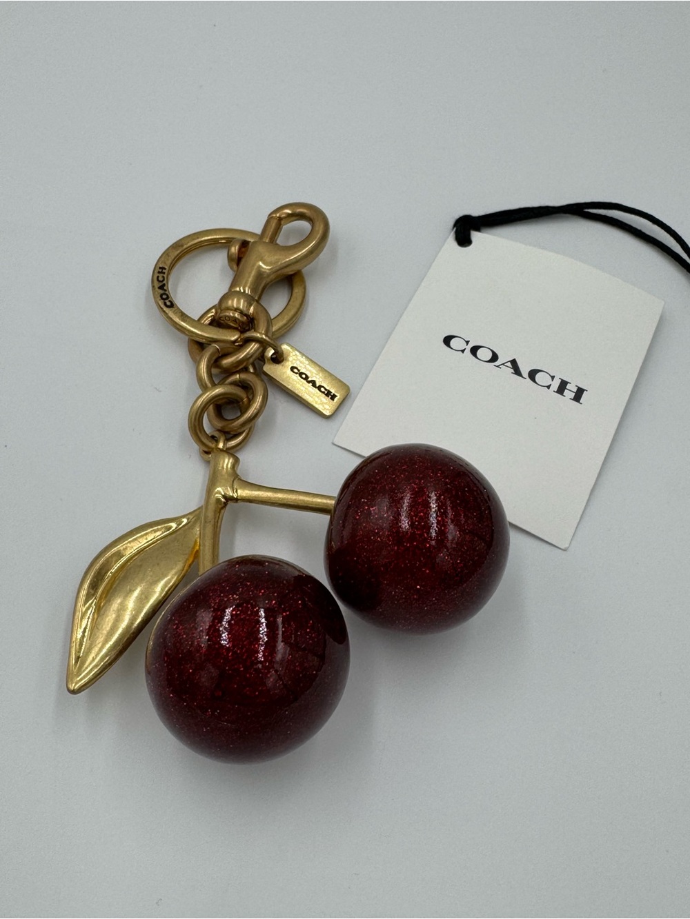 COACH Gold-Tone Keychain with Shimmering Dark Red Cherry Charms